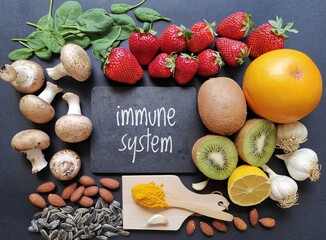 Assortment of food to naturally boost immune system. Immune-boosting foods. Concept of helpful ways to strengthen immunity naturally.