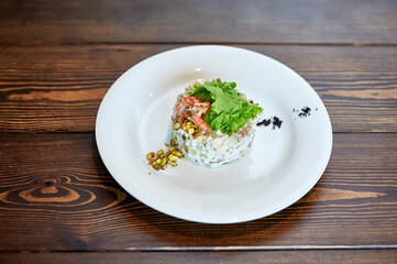 A plate of food sitting on top of a wooden table