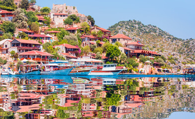 Naklejka premium Kekova island with The ancient Lycian sarcophagus in water - Simena village, Kekova, Turkey.