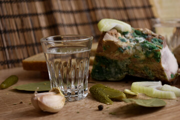 two glasses of vodka and an appetizer