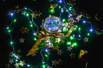 Christmas background with ribbon, golden stars and little lights