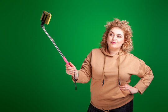 Obese woman taking selfie picture of herself