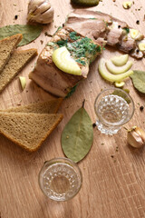 two glasses of vodka and an appetizer