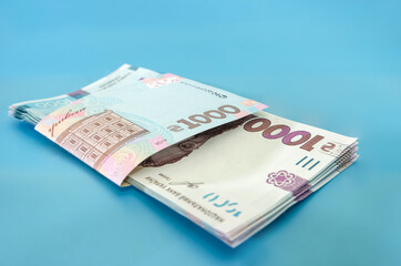 UAH. Money of Ukraine 1000 hryvnia, Ukrainian banknote isolated on blue background