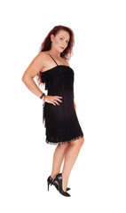  Beautiful woman in a black dress standing in profile