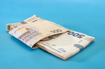 UAH. Money of Ukraine 500 hryvnia, Ukrainian banknotes isolated on blue background