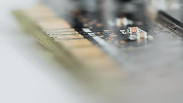 Printed circuit board hardware device with conventional PCI, electrical components, electrolytic capacitors, resistors, transistors, microchips, chips. Macro of sound audio internal expansion card