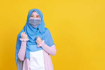 Asian muslim woman in medical mask Coronavirus pandemic disease smiling and greeting isolate background. COVID-19 virus epidemic outbreak.