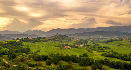 Rural landscape at sunset.  Italy mountains, hills and vineyards. panorama. Amazing sky - 354653592
