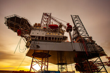oil drilling rig at sunset