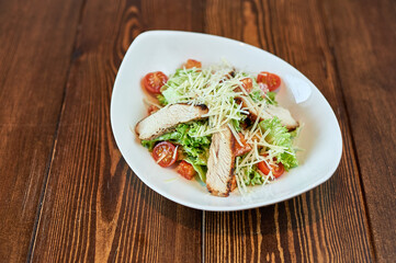 A plate of food sitting on top of a wooden table