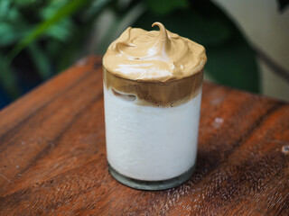 Close up Dalgona coffee on wooden table