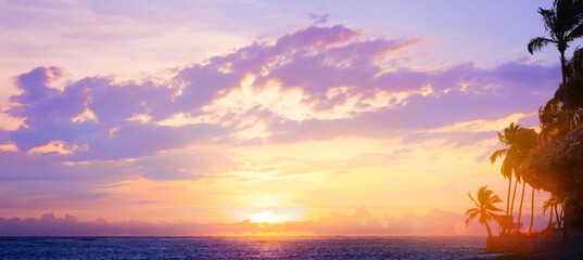 Art beautiful sunrise over the sea on the beach of a tropical island