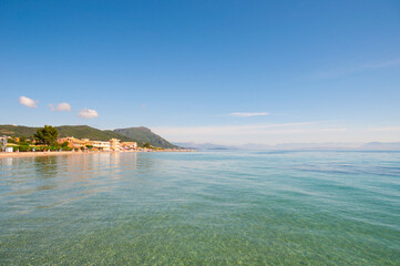 View from sea to a shore with sand beach and hotels