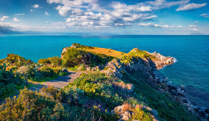 Sunny summer view of Milazzo cape. Bright morning scene of nature reserve Piscina di Venere, Sicily, Italy, Europe. Picturesque seascape of Mediterranean sea. Beauty of nature concept background.