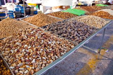 Showcase of various nuts on the food market