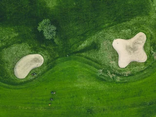 Schilderijen op glas Aerial view of green grass at golf course in Finland © nblxer