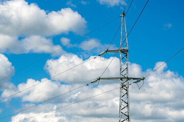 Obraz premium Tower with wires electricity transmission on the sky background