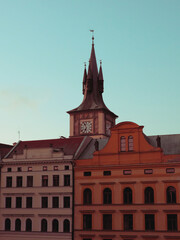 Old Prague clock tower. Picturesque European houses.