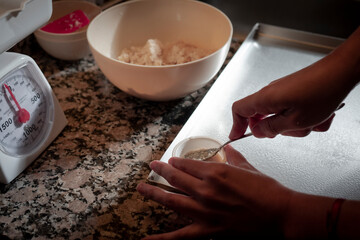 woman hands mixing dough
