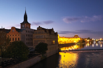 Prague architecture at dawn. Ancient houses on the banks of the Vltava.