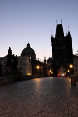 Fototapeta na wymiar Dawn sky over Charles Bridge in Prague. Ancient architecture at dusk.