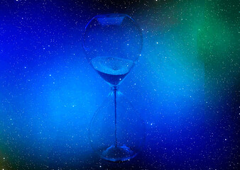 Space and Time with a hour glass suspended in th stars.