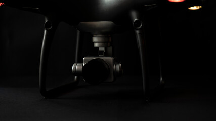 black drone camera on black background