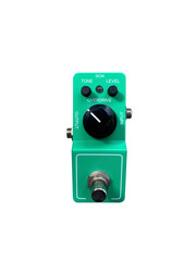 Isolated Mini boutique Green and black knob Vintage overdrive stomp box electric guitar effect on white background with clipping path.