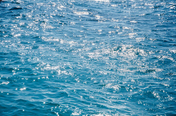 Sea abstract background sunlight on turquoise surface of water