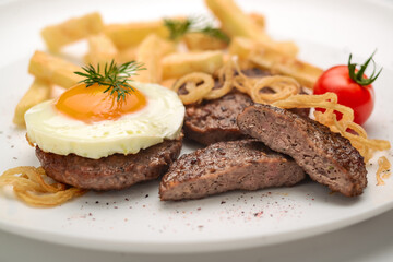 Beef rissole, juicy beef steak with egg and potatoes
