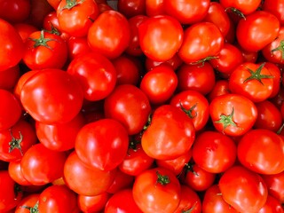 Close-up photo of tomatoes (Beef tomato) in market. Fruit and vegetable background. Texture red tomato. 