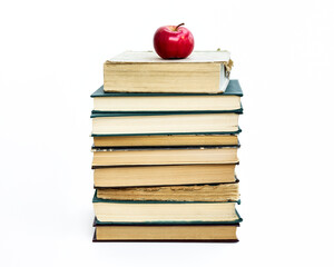 a stack of old books. A red apple lies on top. The concept of an idea came like a Newton's apple....