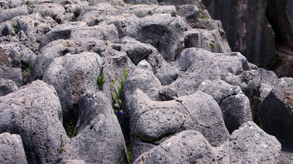 gray plasticine stones on a mountain in central Peru