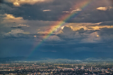 CHIANG MAI, THAILAND - May 27,2020: Aerial Panorama View of Chiang Mai City with rain cloud and rainbow, Thailand