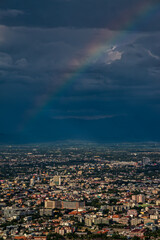 CHIANG MAI, THAILAND - May 27,2020: Aerial Panorama View of Chiang Mai City with rain cloud and rainbow, Thailand