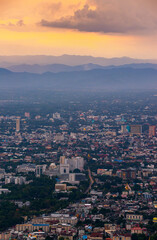 Fototapeta na wymiar CHIANG MAI, THAILAND - May 27,2020: Aerial view Chiang Mai City skyline and lights city in twilight night background from the aerial view point on top of mountain