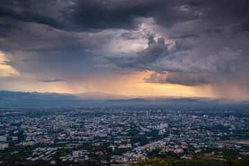 Fototapeta na wymiar CHIANG MAI, THAILAND - May 27,2020: Aerial Panorama View of Chiang Mai City with rain and dramatic cloud, Thailand