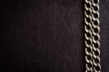 Metal chain on a dark background.