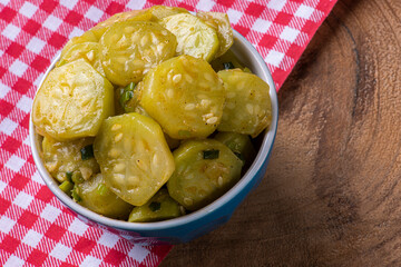 .Cooked gherkin dish. On a wooden table. Typical Brazilian dish