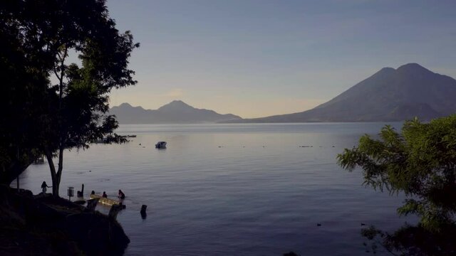 Maya women wash clothes beside Lake Atitlan in Guatemala.