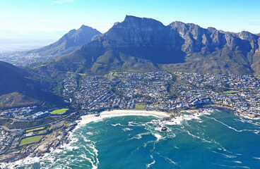 Obraz premium Cape Town, Western Cape / South Africa - 06/07/2019 - Aerial photo of Camps Bay, Cape Town CBD and Table Mountain
