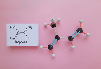 Molecular structure model and structural chemical formula of isoprene molecule. Isoprene or...