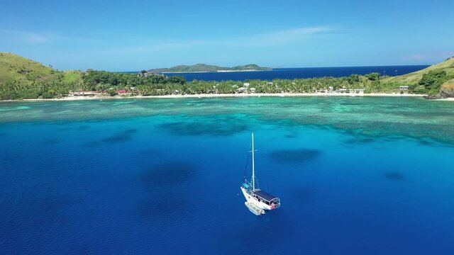 A boat is seen off the coast of Yanuya Island, Fiji.