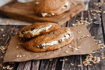 Tasty cakes with cottage cheese and raisins. Patties on a wooden table. Country style