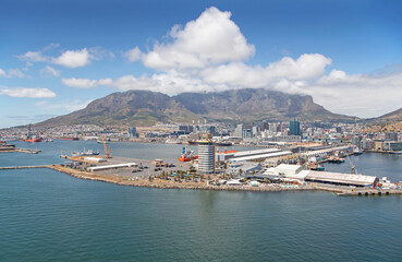 Fototapeta na wymiar Cape Town, Western Cape / South Africa - 02/05/2020 - Aerial photo of Cape Town V&A Waterfront & Harbour with Table Mountain in the background