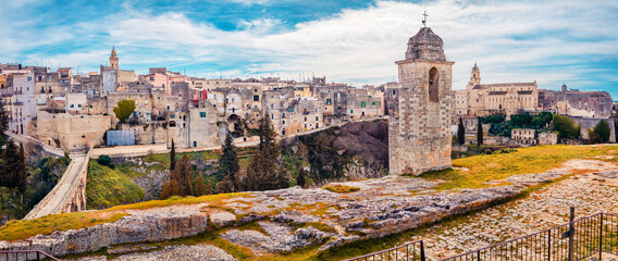 Panoramic summer cityscape of old Latin town - Gravina in Puglia with Church of Saint Nicholas on background. Splendid morning landscape of Apulia, Italy, Europe. Traveling concept background.