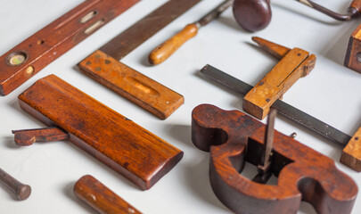 Close-up of old traditional tool small wooden file angle gouging seam plane wood craft culture...