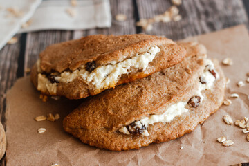 Tasty cakes with cottage cheese and raisins. Patties on a wooden table. Country style