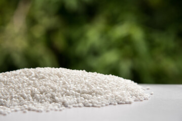 White Pet Chips Semi Dull,PET chips recycle,PET polyester chips with blurred green background
